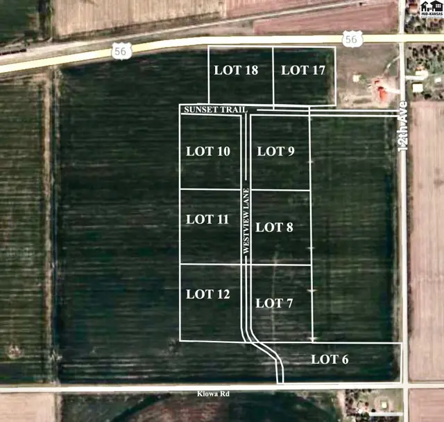 Aerial view of a rural land parcel divided into numbered lots with road access.