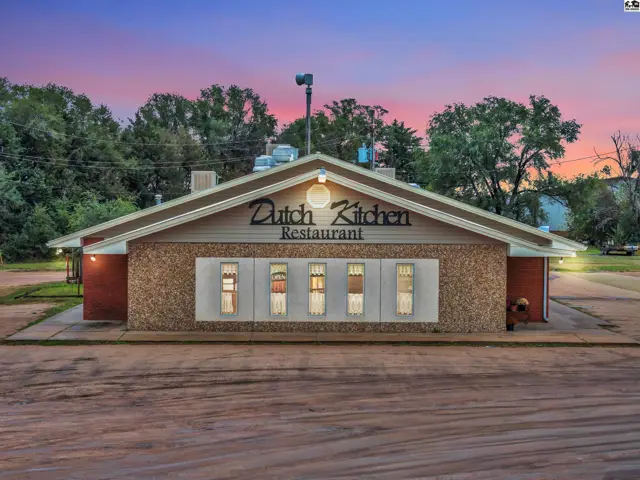 Exterior of a single-story brick and stone restaurant with a prominent "Dutch Kitchen Restaurant" sign.