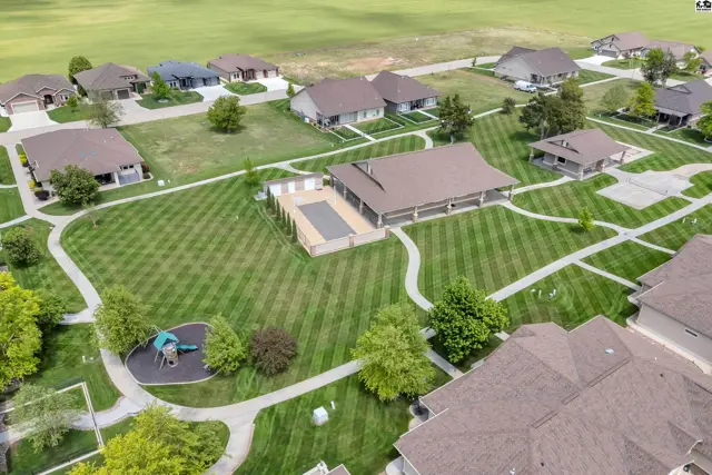 This property features a swimming pool, playground, and several residential structures.