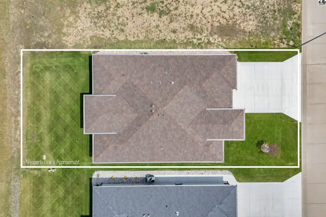 This aerial view shows a single-family home with a pitched roof and attached garage.