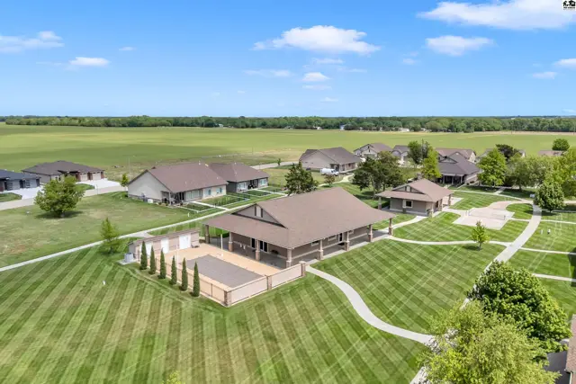 This property features a large covered pavilion, a pool, and several single-family homes.