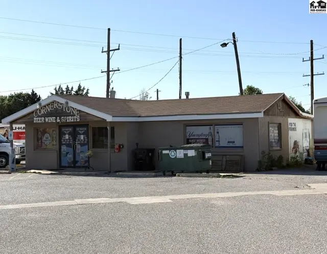 Cornerstone Beer Wine & Spirits storefront with a tan stucco exterior and large display windows.