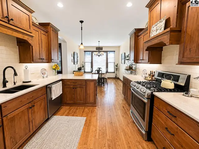 Gas/propane stove and view of dining area at the end with west facing windows.