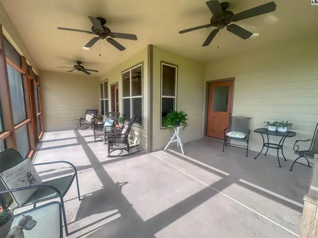 Wraparound screened in porch with access from living room & SW bdrm. Concrete floor & ceiling fans.