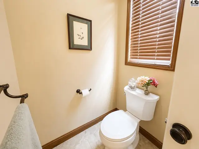 Separate toilet room with door and window.