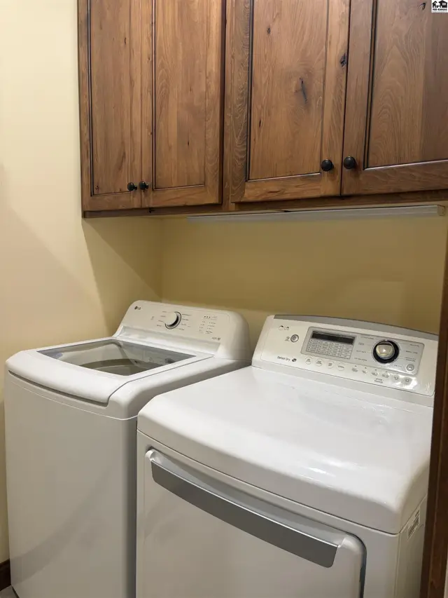 Laundry room located one main floor with wood floors.