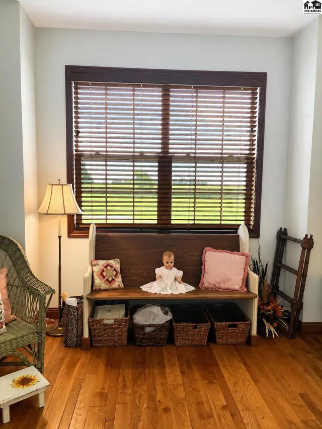 Bedroom with wood floors, spacious closet located on front of house.