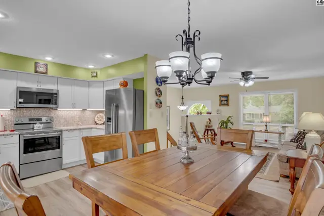 Open-concept living area with a kitchen, dining space, and seating area.