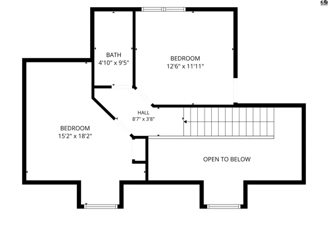 Two bedrooms and a bathroom are located on the upper level, accessible by stairs.