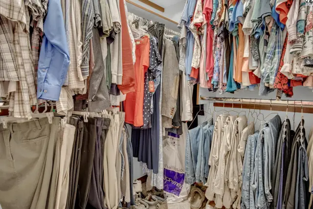Spacious walk-in closet with ample hanging and shelving space.