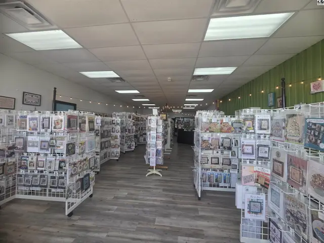 This commercial space features ample display shelving and a wood-look floor.