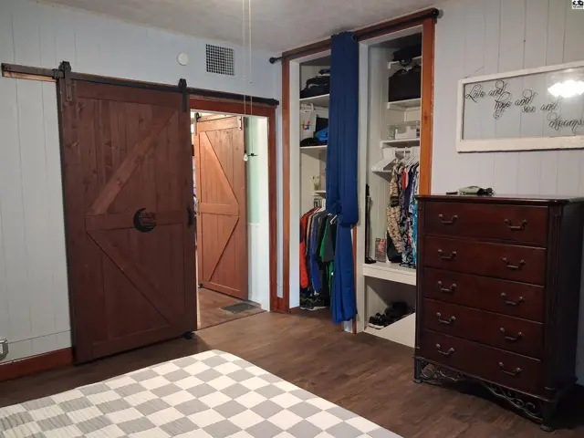 Master bedroom with doorway leading to bathroom